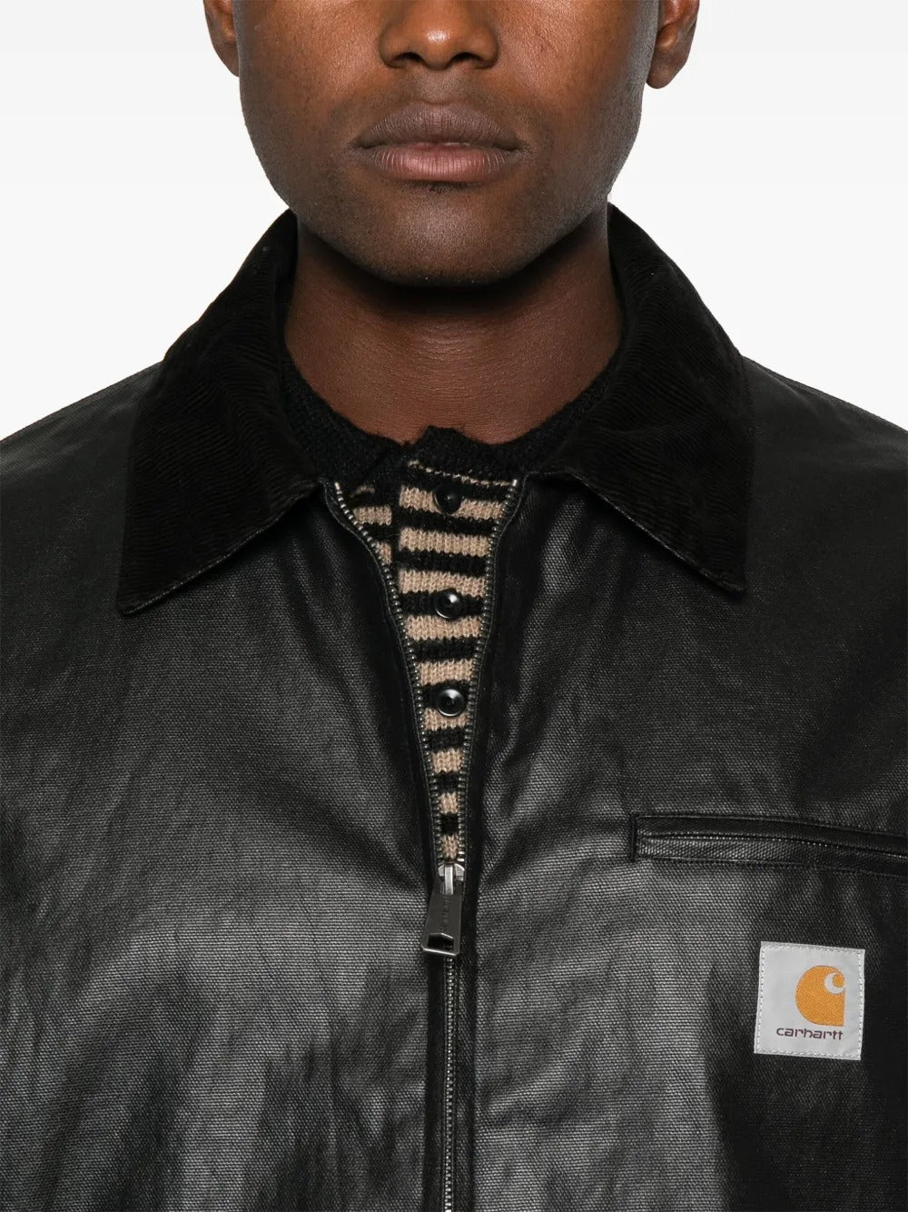 Close up of black jackets, showing texture of the cotton and polyamide fabric