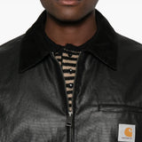 Close up of black jackets, showing texture of the cotton and polyamide fabric