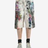 White shorts worn by a person, showing the shorts's fit