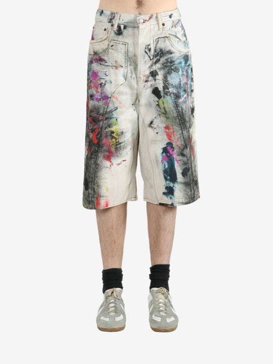 White shorts worn by a person, showing the shorts's fit