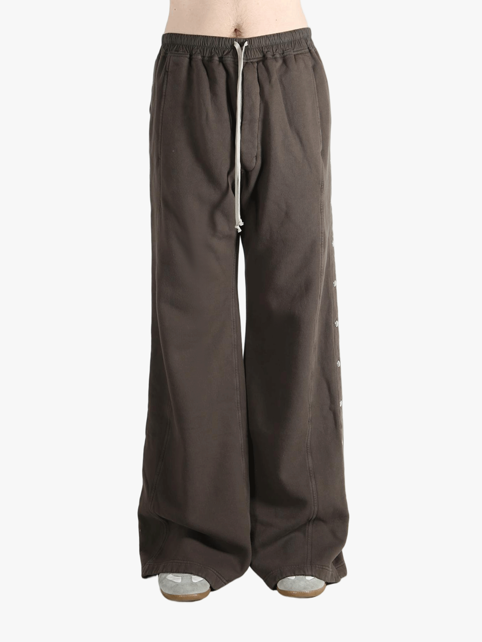Brown pant worn by a person, showing the cotton fit