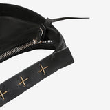 Close up of the black bag, showing texture of the leather fabric