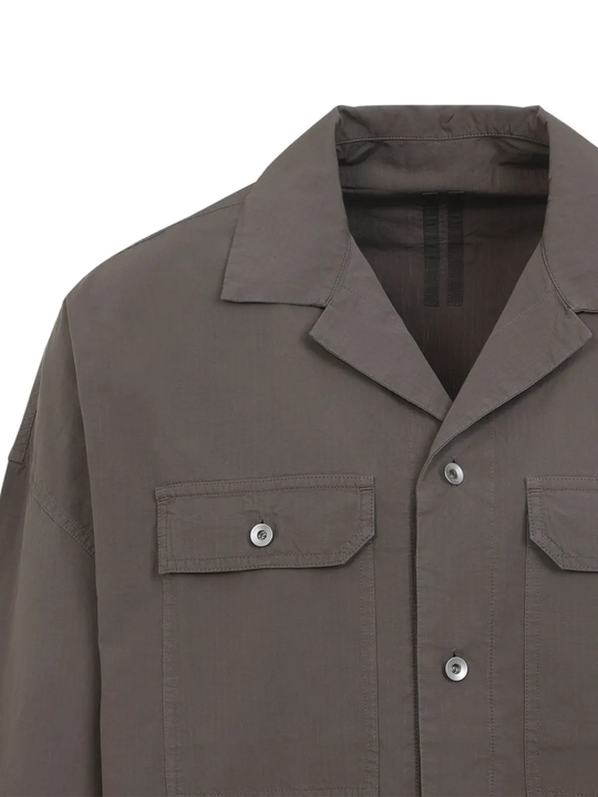 Close up of grey shirt, showing texture of the cotton fabric
