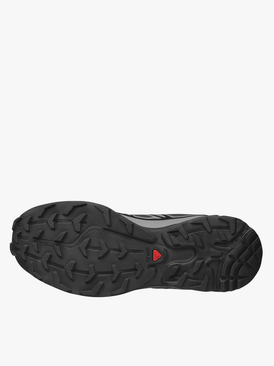 Close up of black sneakers, showing texture of the rubber fabric