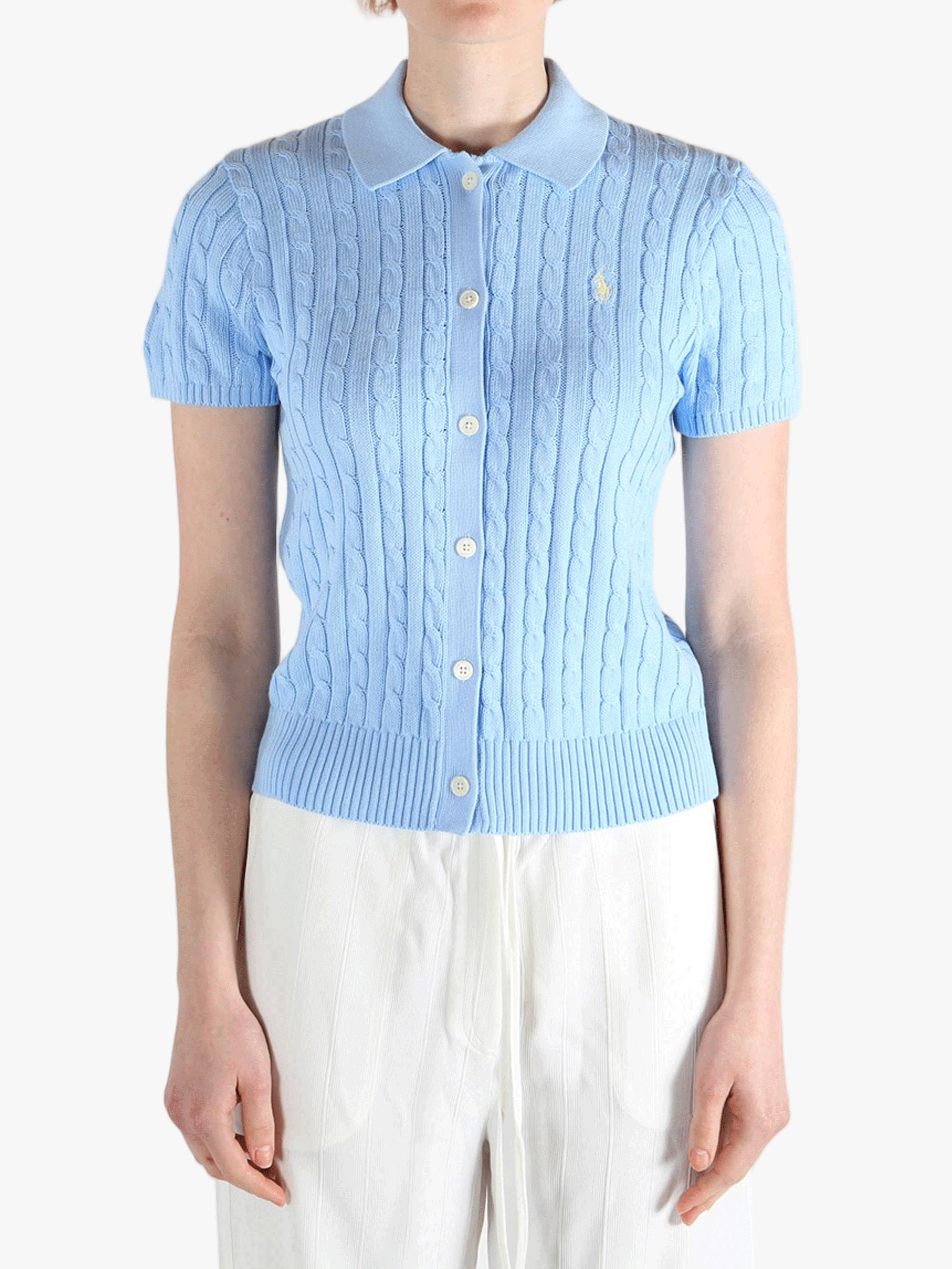 Blue cardigan worn by a person, showing the cardigan's fit