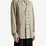 Tan shirt worn by a person, showing the shirt fit