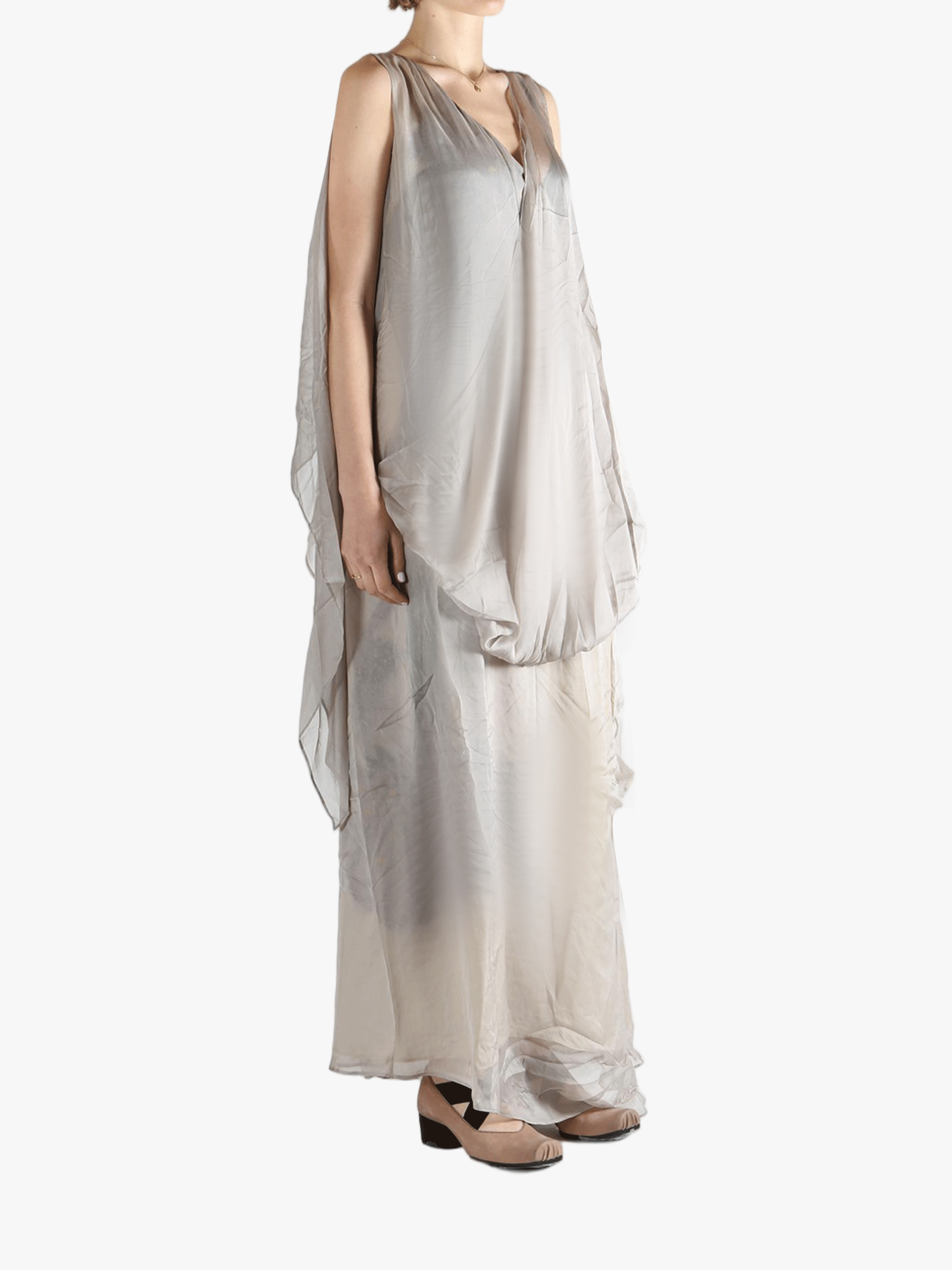 Silver dress worn by a person, showing the loose fit.