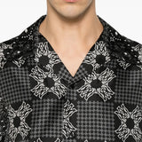 Black shirt worn by a person, showing the shirt fit