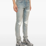 Blue pants worn by a person, showing the pants fit