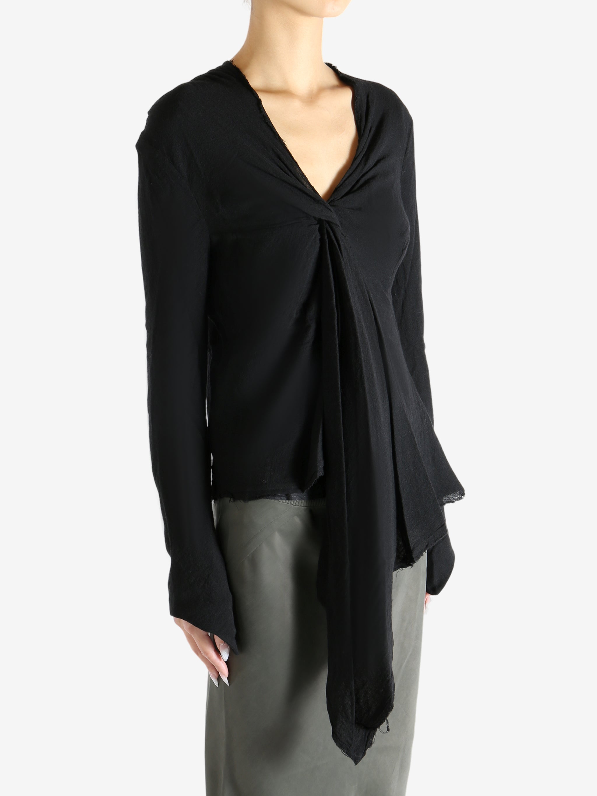 Black top worn by a person, showing the top's fit