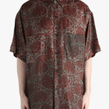 Grey shirt worn by a person, showing the shirt's fit