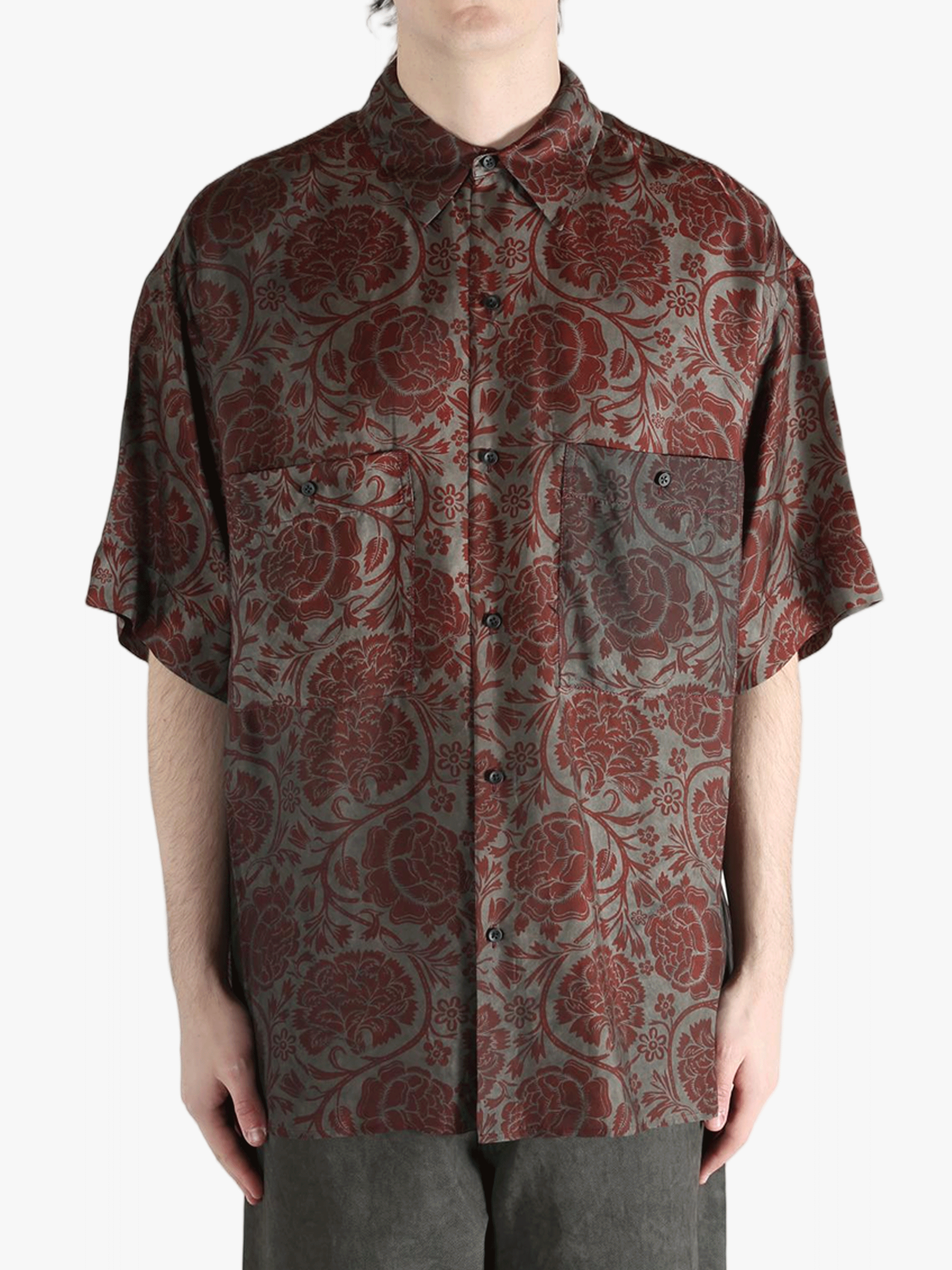 Grey shirt worn by a person, showing the shirt's fit