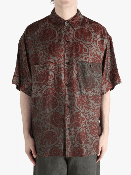 Grey shirt worn by a person, showing the shirt's fit