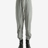 Grey pants worn by a person, showing the pants's fit