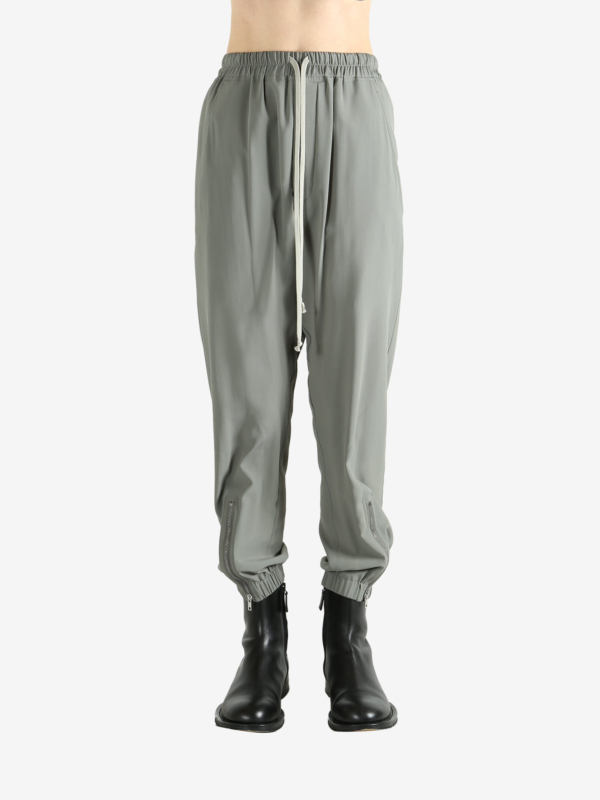 Grey pants worn by a person, showing the pants's fit