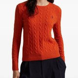 Orange knitwear worn by a person, showing the knitwear's fit