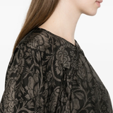 close up of black tops, showing texture of the viscose fabric 