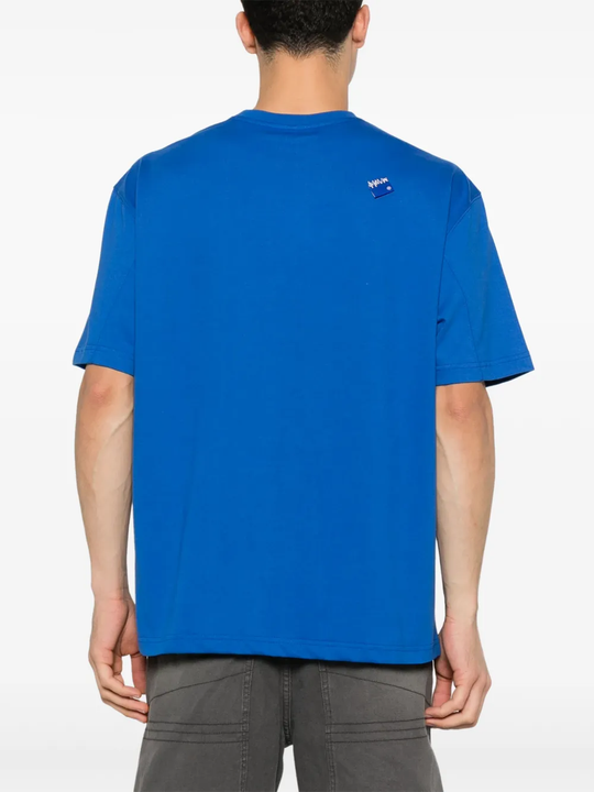 Blue T-shirt worn by a person, showing the shirt's fit