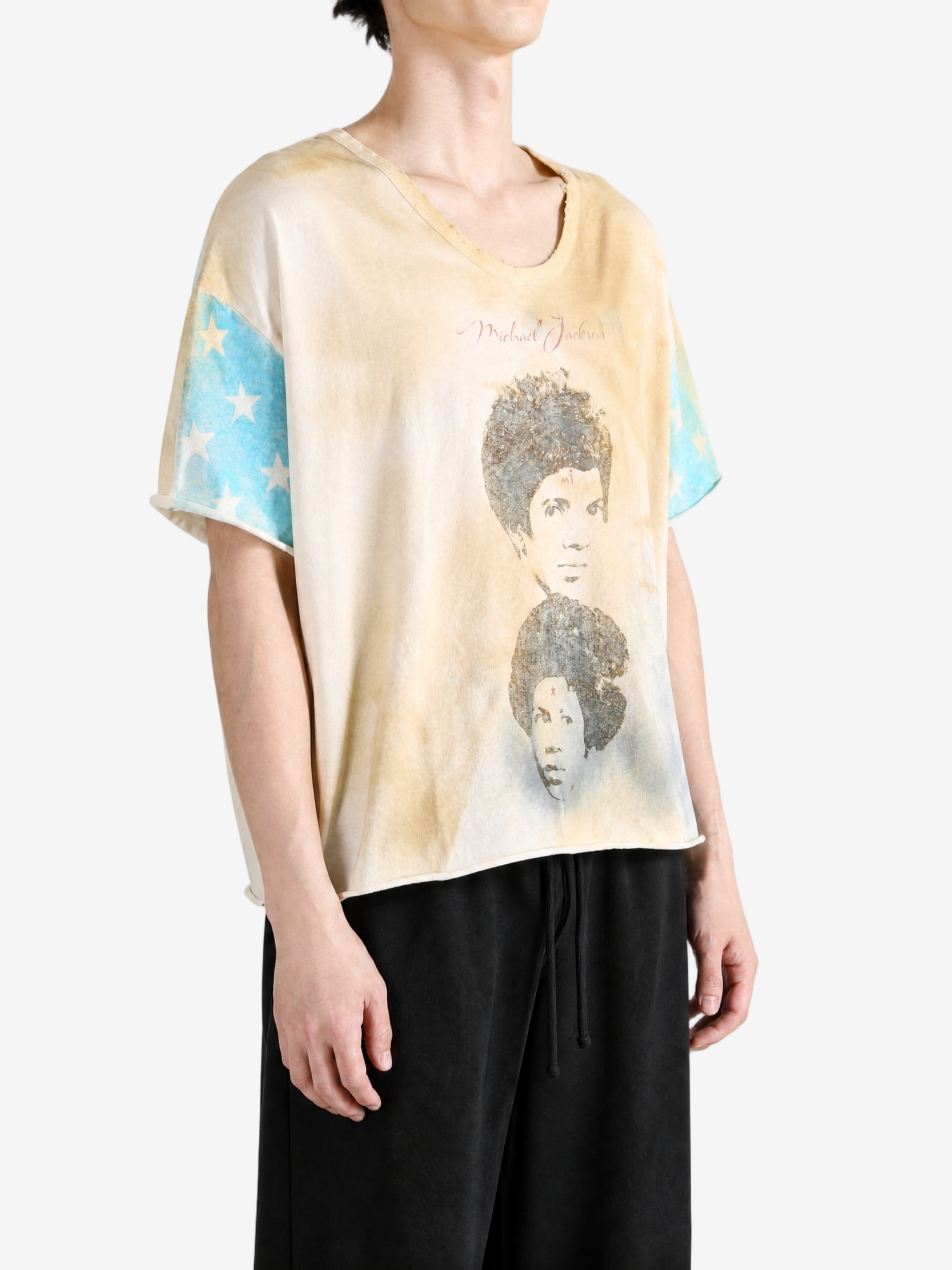Tan t-shirt worn by a person, showing the t-shirt fit