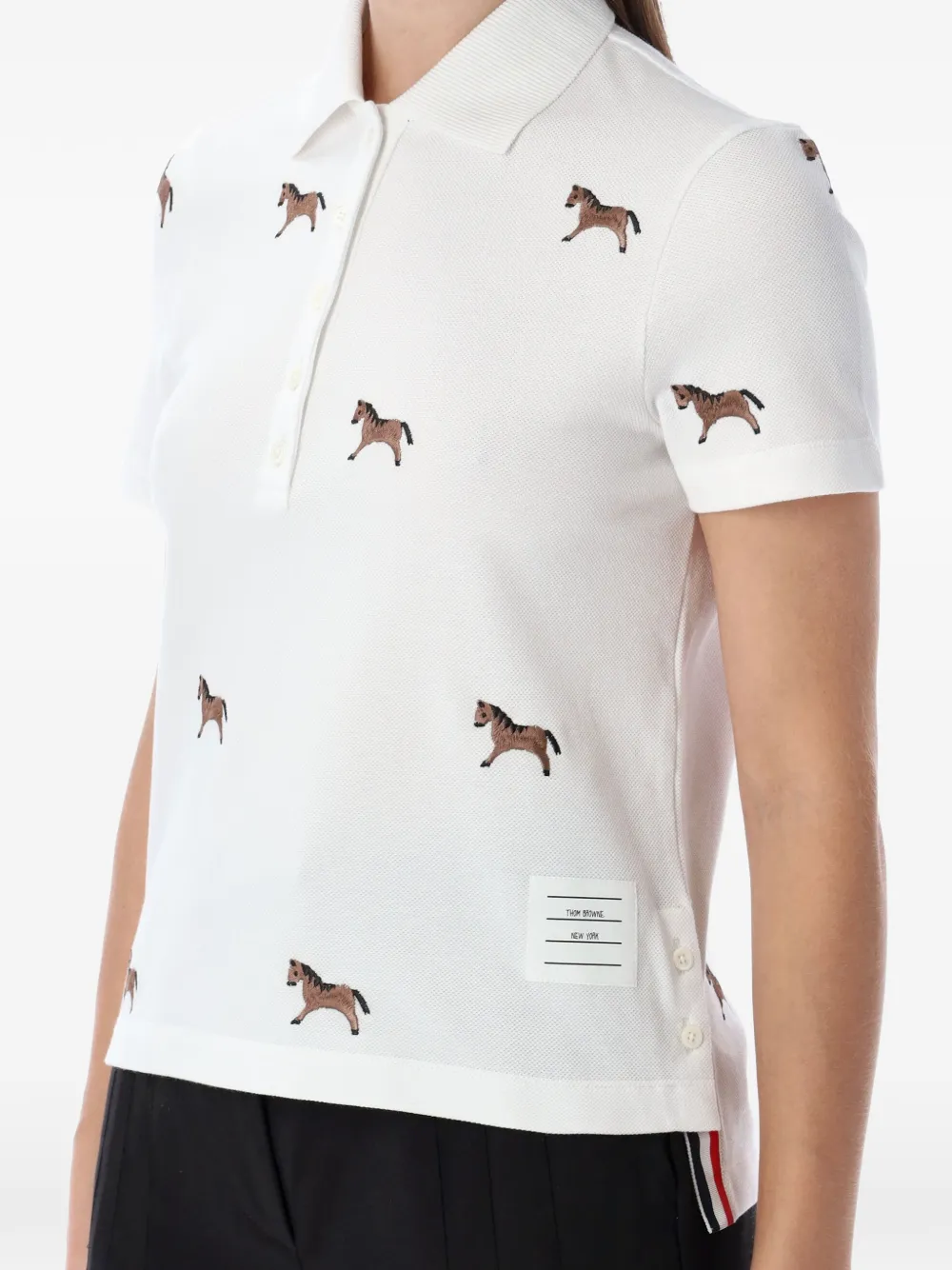 White shirt worn by a person, showing the shirt's fit