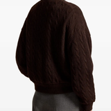 Brown jacket worn by a person, showing the jacket fit
