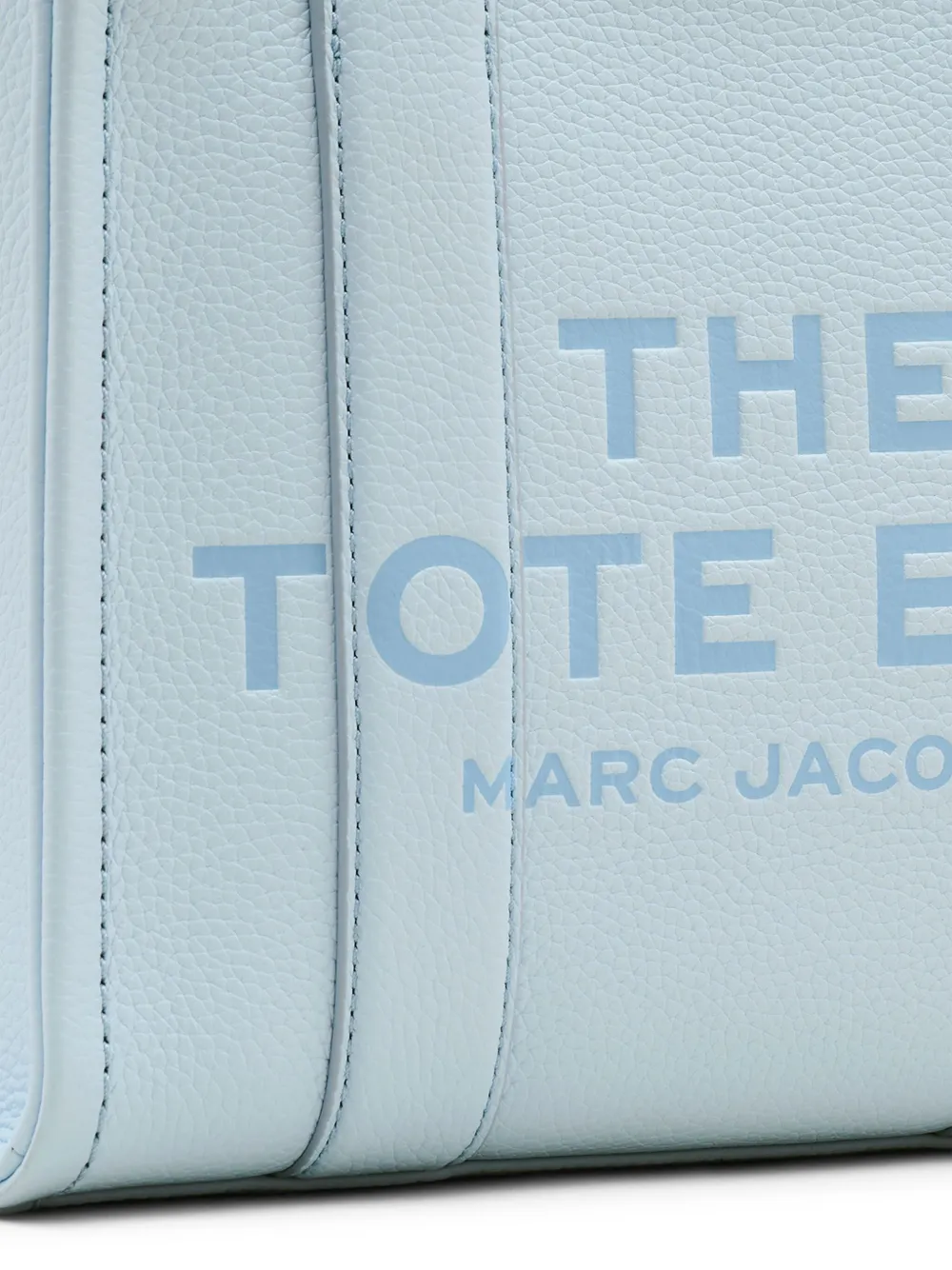 Close up of blue bag, showing texture of the calf leather fabric