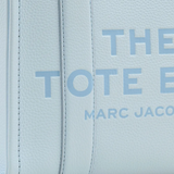 Close up of blue bag, showing texture of the calf leather fabric