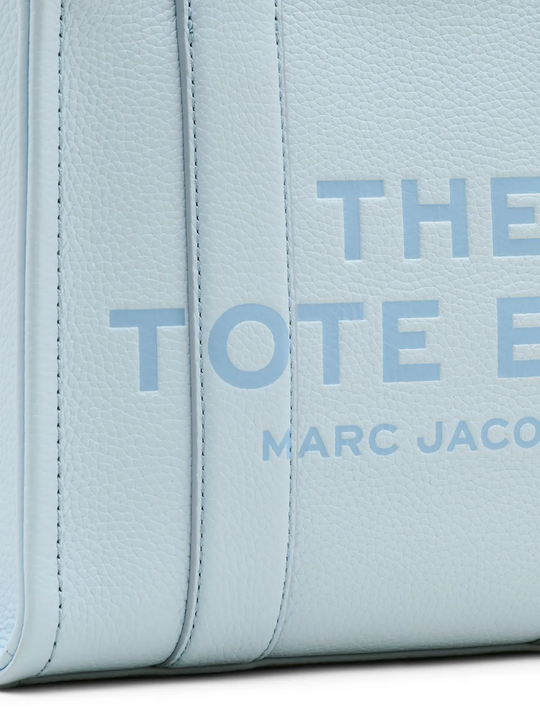 Close up of blue bag, showing texture of the calf leather fabric