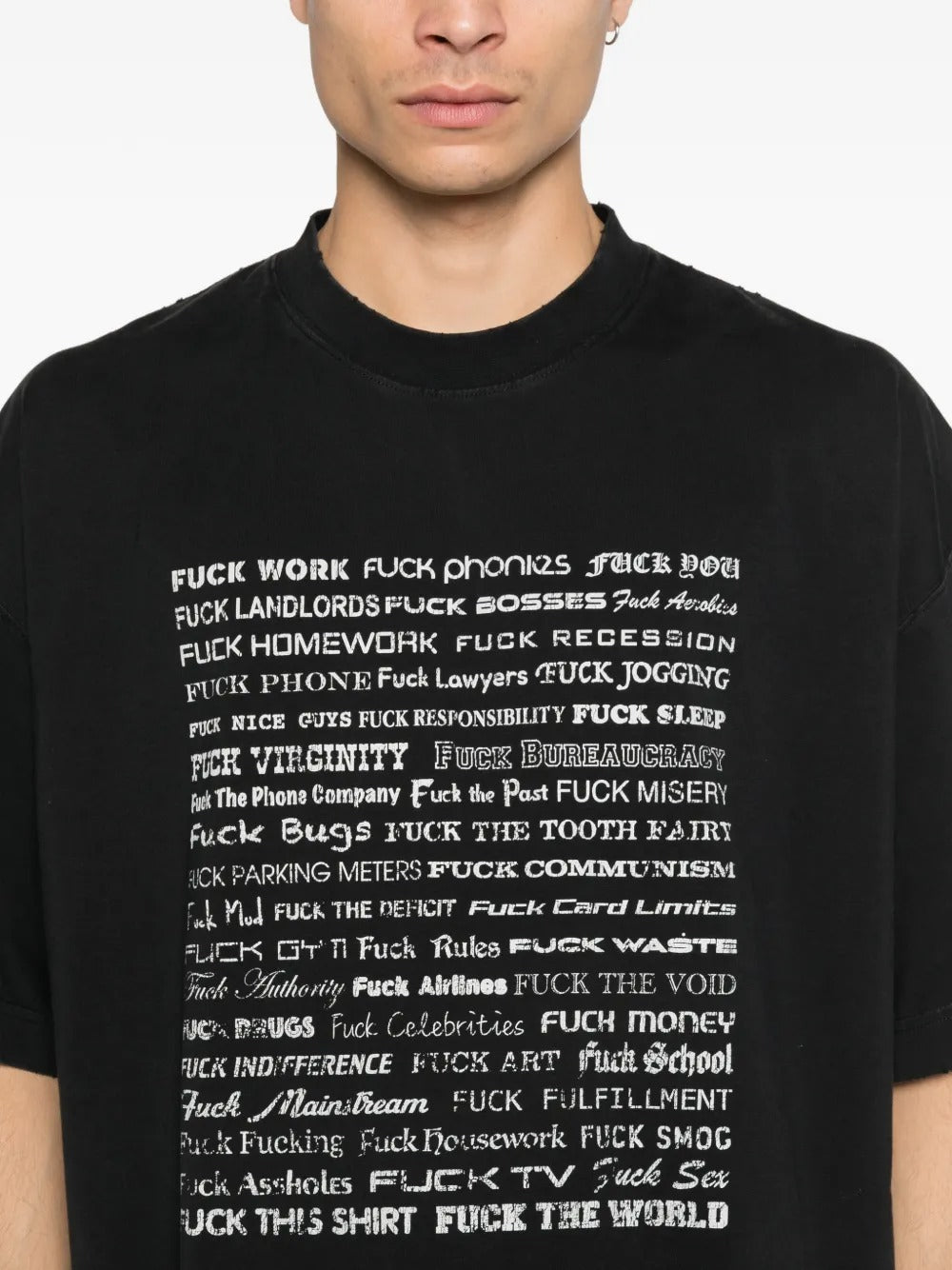 Close up of the black t-shirt, showing texture of the cotton fabric