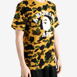 Yellow t-shirt worn by a person, showing the t-shirt fit