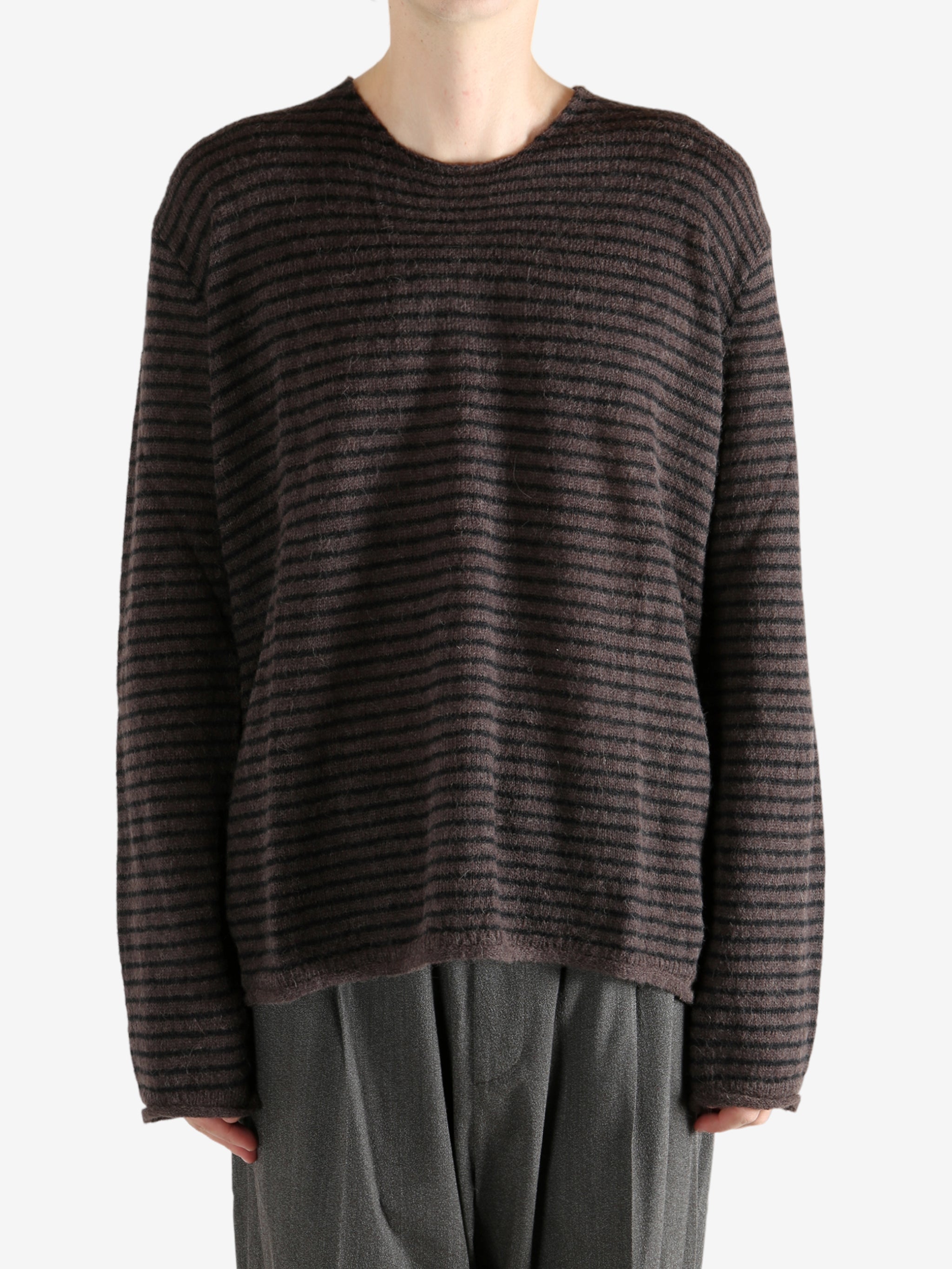 Brown shirt worn by a person, showing the shirt's fit