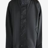 Black jacket worn by a person, showing the jacket's fit