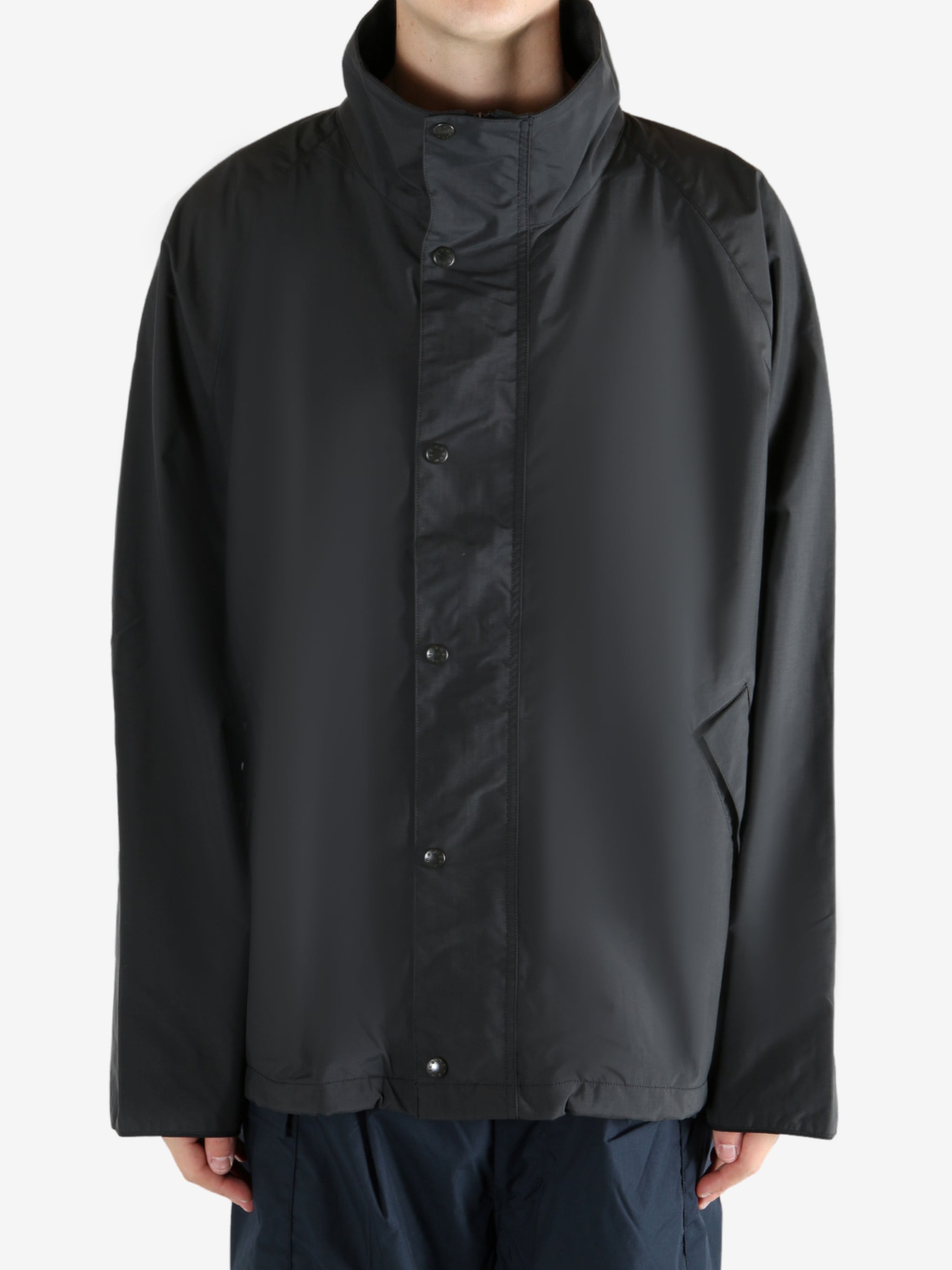 Black jacket worn by a person, showing the jacket's fit