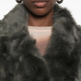Grey jacket worn by a person, showing the jacket fit