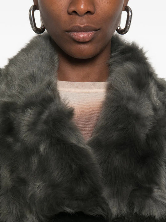 Grey jacket worn by a person, showing the jacket fit
