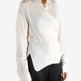 Tan shirt worn by a person, showing the shirt's fit