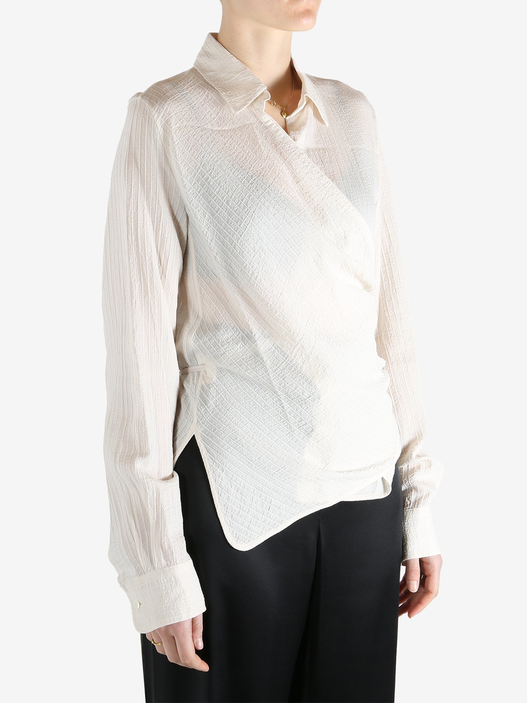 Tan shirt worn by a person, showing the shirt's fit