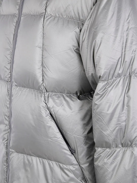 Close up of the grey parka, showing texture of the nylon fabric