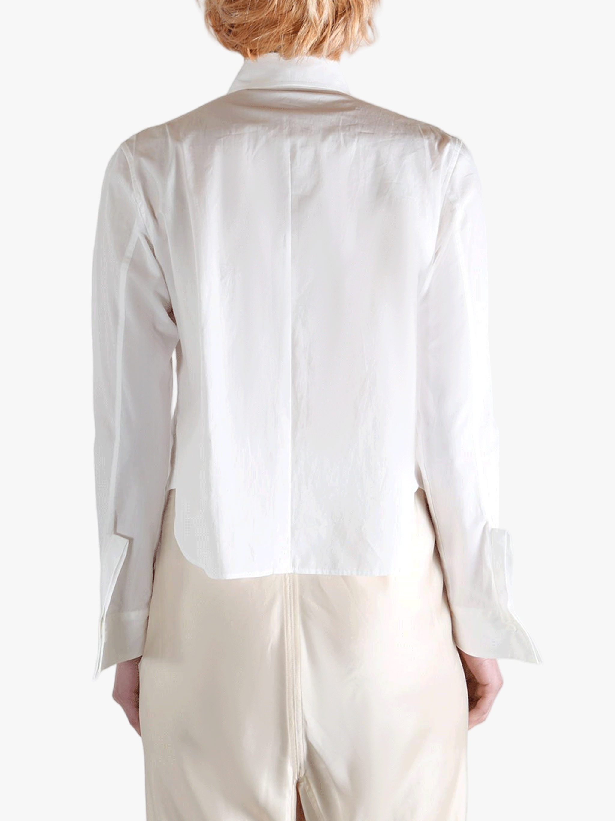 White shirts worn by a person, showing the shirts fit