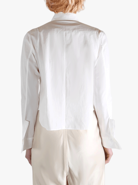 White shirts worn by a person, showing the shirts fit