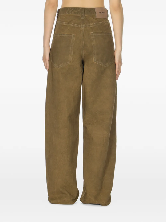 Brown pants worn by a person, showing the pants fit