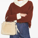 Tan bags worn by a person, showing the bags's fit