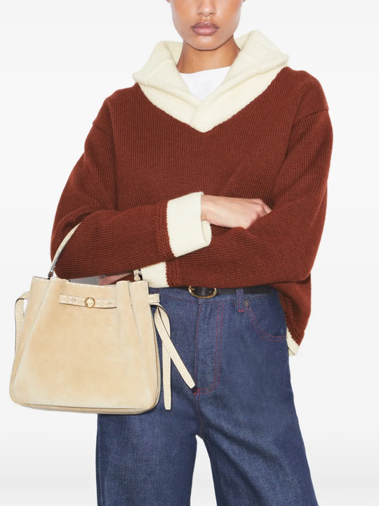 Tan bags worn by a person, showing the bags's fit