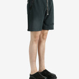 Black shorts worn by a person, showing the shorts’ fit