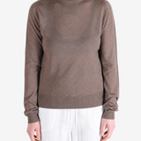 Brown top worn by a person, showing the top fit