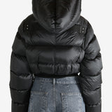 Black jacket worn by a person, showing the jacket fit