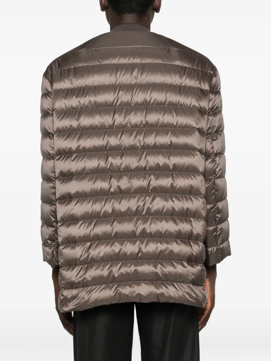 Brown parka worn by a person, showing the parka fit