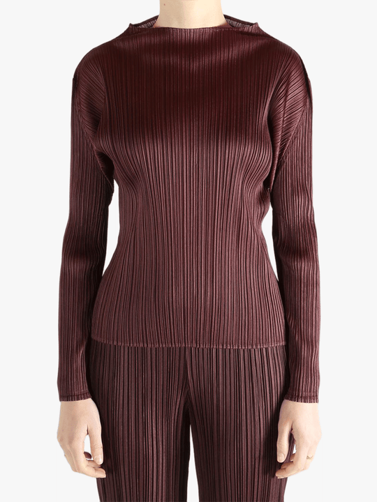 Burgundy shirt worn by a person, showing the shirt fit