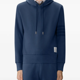 navy hoodie worn by a person, showing the hoodie fit