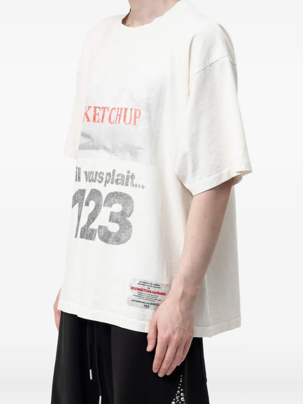 White t-shirt worn by a person, showing the t-shirt fit